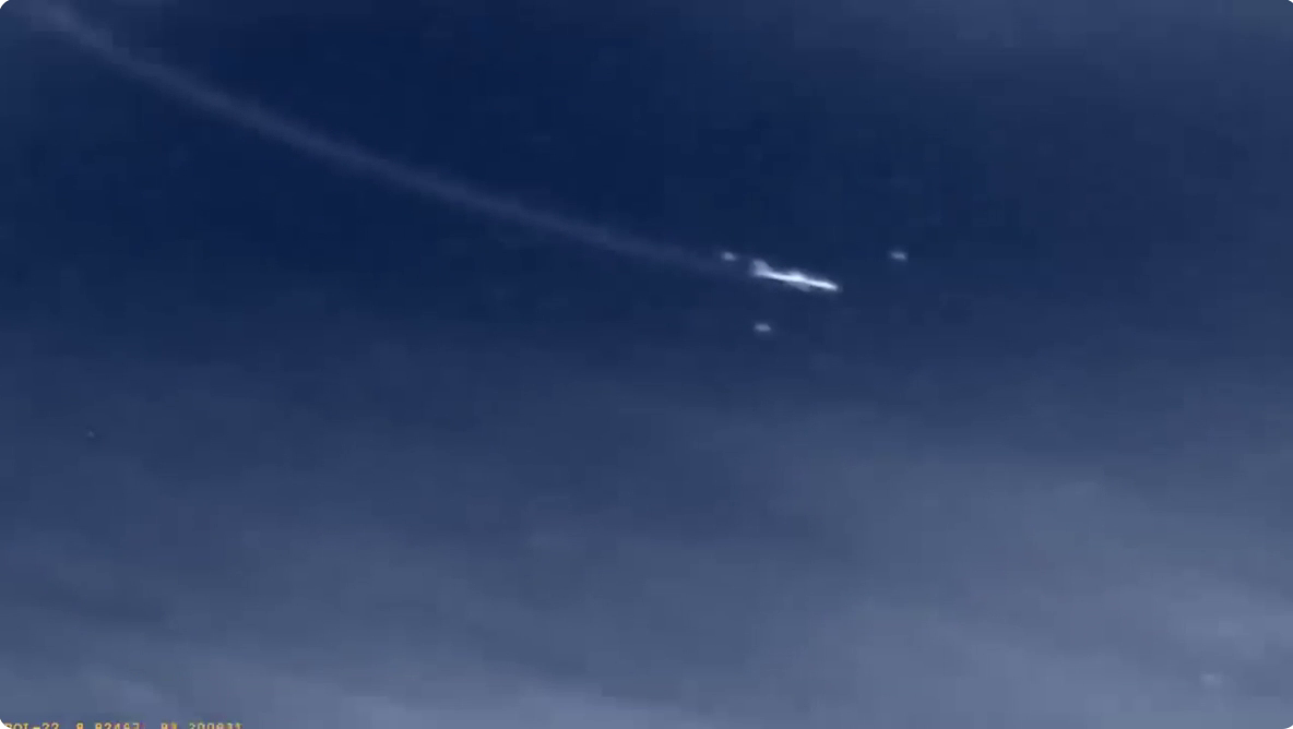 Satellite-style still showing the airliner-like target and surrounding formation